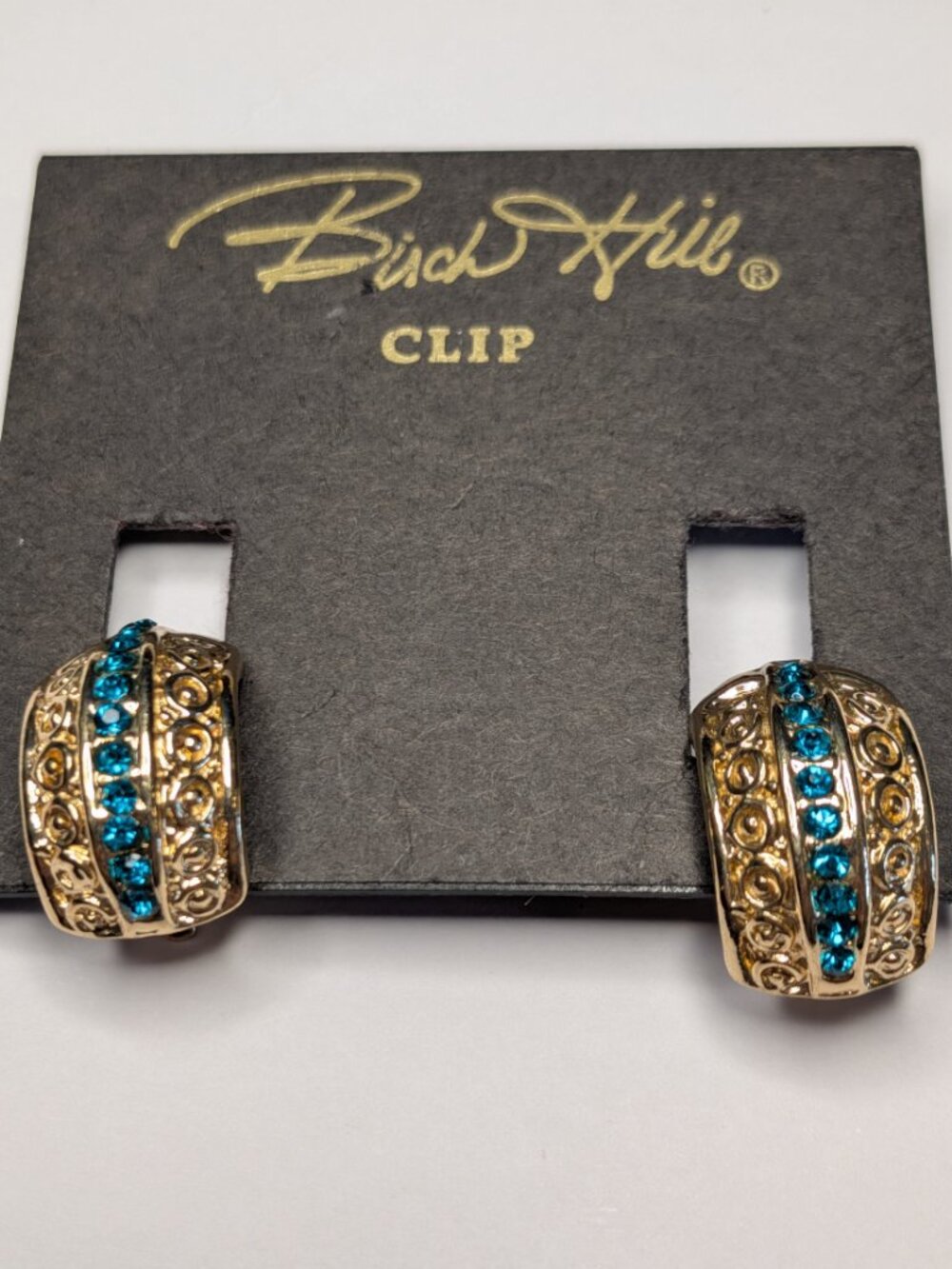 Title: Birch Hill Turquoise Rhinestone Clip Earrings – Gold‑Tone Textured